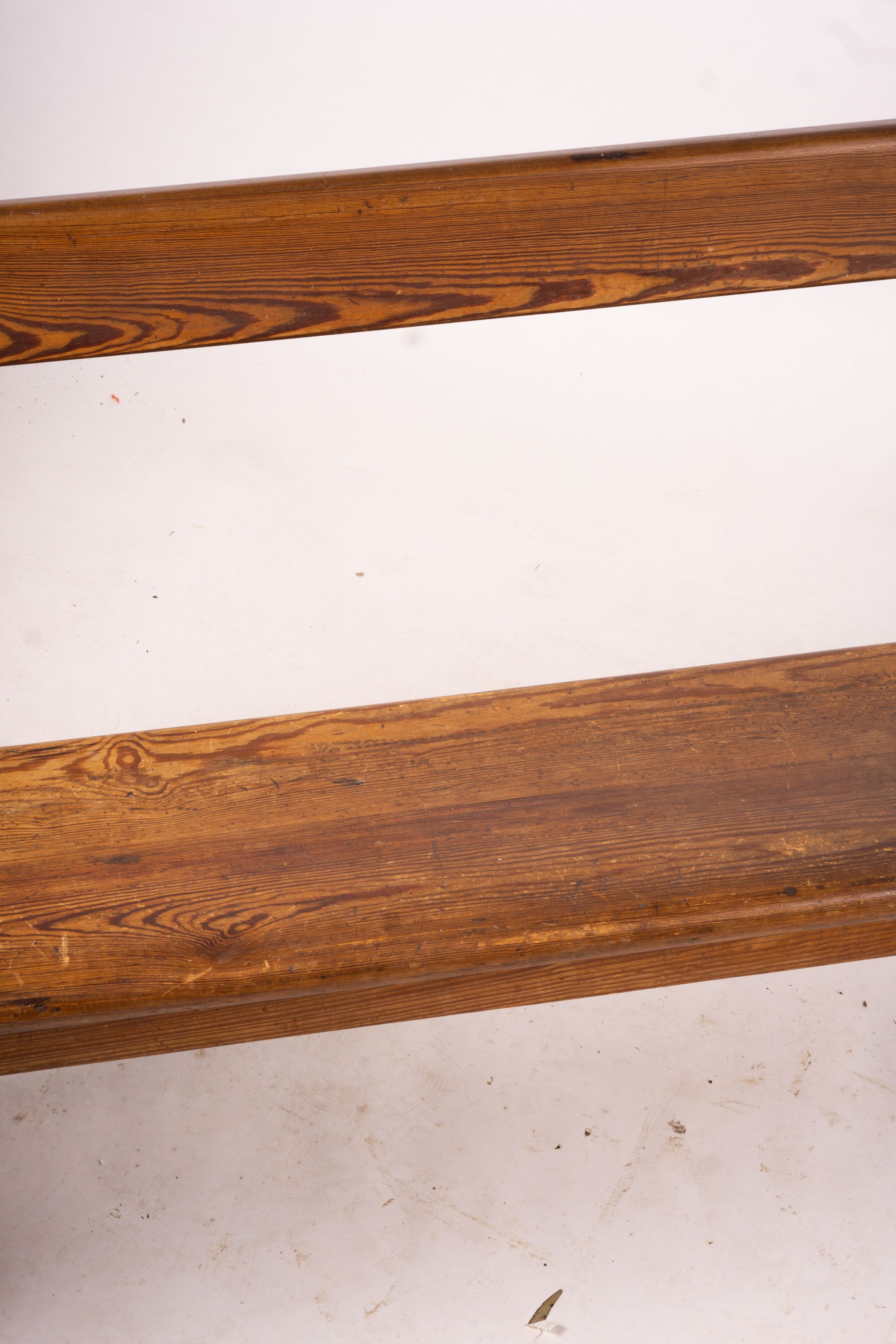 A Victorian pitch pine bench seat, W.214cm H.79cm